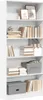 A white bookshelf filled with books and decorative items. Produktbild-Vorschau