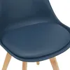 Close-up of a blue upholstered chair with wooden legs. Podgląd zdjęcia produktu