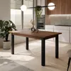 A dining table in a modern kitchen setting with a large window overlooking a landscape. Produktbild-Vorschau