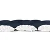 A close-up, side view of a navy blue and white footmuff, lying flat against a white background. Produktbild-Vorschau