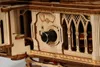 A close-up view of a wooden gramophone model, focusing on the control panel with a dial and a meter. Náhľad obrázku produktu