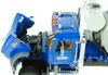 A close-up view of a blue MACK Granite cement mixer truck toy, with the hood open to reveal the engine. Podgląd zdjęcia produktu