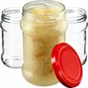 Three glass jars, one filled with sauerkraut, and a red lid are arranged on a white background. Anteprima dell’immagine prodotto