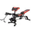 A weight bench with various attachments, including a leg curl/extension apparatus and a preacher curl pad, is shown against a white background. Produktbild-Vorschau