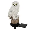 A white owl garden stake with a solar panel. Náhled obrázku produktu