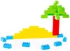 A construction of toy building blocks depicting a beach scene with a palm tree. Voir les images du produit