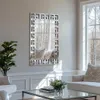 A modern living room with a decorative mirror on the wall, a sofa, and a coffee table. Náhled obrázku produktu