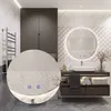 A modern bathroom with a vanity, sink, and a round LED mirror. Voir les images du produit