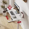 A white standing desk with a monitor, keyboard, mouse, and a plant. Podgląd zdjęcia produktu
