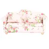 A miniature sofa with a floral pattern. Náhled obrázku produktu