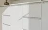 A close-up view of a white dresser or cabinet with multiple drawers. Náhľad obrázku produktu