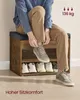 A person is sitting on a shoe bench and tying their shoes. The shoe bench has shelves for shoes. Produktbild-Vorschau