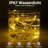 A glass of water with string lights submerged in it, demonstrating waterproofing. Produktbild-Vorschau