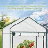 A greenhouse with a tomato plant inside, set against a backdrop of changing seasons and a sky with clouds. Produktbild-Vorschau