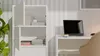 A white cabinet and a desk with a laptop and a chair in a room. Voir les images du produit