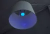 A close-up of a blue LED light bulb inside a white lampshade. Anteprima dell’immagine prodotto