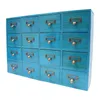 A close-up, angled view of a blue wooden cabinet with 16 drawers. Each drawer has a bronze-colored label pull. Produktbild-Vorschau