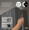 A hand is shown adjusting a dark gray curtain rod with a wrap-around bracket design, demonstrating its functionality. Podgląd zdjęcia produktu