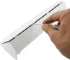 A hand using a screwdriver to open a white electrical outlet strip. Produktbild-Vorschau