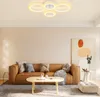 A modern living room with a brown leather sofa, coffee table, and abstract art on the wall. Voir les images du produit