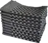 A stack of folded kitchen towels with a checkered pattern. Produktbild-Vorschau