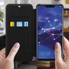 A person is holding a smartphone with a wallet case open, showing a credit card inside. Anteprima dell’immagine prodotto