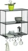 A three-tiered wall shelf with a plant, bowls, and mugs. Produktbild-Vorschau