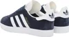 A pair of navy blue Adidas Gazelle sneakers with white stripes and soles, shown from a side-rear angle. Produktbild-Vorschau
