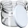 Several clear glass jars with white lids are arranged in a group, with one lid prominently placed in the foreground. Podgląd zdjęcia produktu