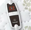 A close-up of a Beurer heating pad controller with temperature settings and a timer. Produktbild-Vorschau