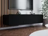 A black TV cabinet is mounted on a slatted wooden wall, with a TV above it. Decorative items and a plant are visible. Produktbild-Vorschau