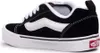 A side view of a black and white Vans sneaker. Voir les images du produit
