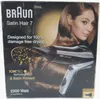 The image shows the packaging of a Braun Satin Hair 7 hair dryer, featuring a model and product details. Produktbild-Vorschau