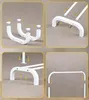 Four panels showing the assembly steps of a white metal coat rack. Náhled obrázku produktu