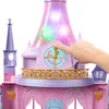 A close-up of a toy castle with a hand interacting with a clock feature. Podgląd zdjęcia produktu