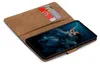 A brown book-style phone case is open, showing a smartphone with a blue-themed wallpaper. Two credit cards are tucked into a slot on the inside of the case. Náhled obrázku produktu