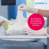 A hand in a white glove pulls a disinfecting wipe from a package, with a pink circular overlay highlighting a marketing claim. Produktbild-Vorschau