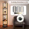A floor lamp with shelves is shown next to a chair, with a graphic overlay illustrating its dimming feature and a close-up of a foot switch. Podgląd zdjęcia produktu