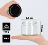 A hand holds a black lid while another hand holds a glass jar with dimensions indicated. Produktbild-Vorschau