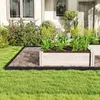 A garden scene with a raised garden bed and a lawn. Voir les images du produit