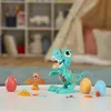 A Play-Doh T-Rex toy set with dinosaur figures and eggs on a white table. Produktbild-Vorschau