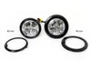 Two round LED lights with black bezels and silver LED arrays are shown on a white background. Two black trim rings are placed in front of the lights. Text indicating measurements is present. Anteprima dell’immagine prodotto
