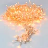 A pile of warm white LED string lights with a transparent wire is shown on a light gray and white background. Produktbild-Vorschau