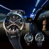 A person driving a car at night, with a watch prominently displayed. Voir les images du produit