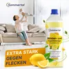 A woman is playing with her baby on a sofa in a bright living room, with a bottle of cleaning product prominently displayed. Produktbild-Vorschau