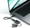 A close-up shot of a USB-C adapter connected to a laptop. Anteprima dell’immagine prodotto