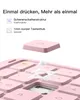 Close-up view of a pink keyboard with a detached keycap and internal mechanism shown. Produktbild-Vorschau