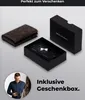 A brown cardholder and its black gift box are displayed on a light gray background, with a man in the lower left corner. Produktbild-Vorschau