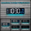 A digital clock displayed on a brick wall background, with multiple smaller images showing different brightness levels. Produktbild-Vorschau