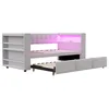 A modern sofa bed with integrated shelving and LED lighting, shown with the pull-out bed extended. Voir les images du produit